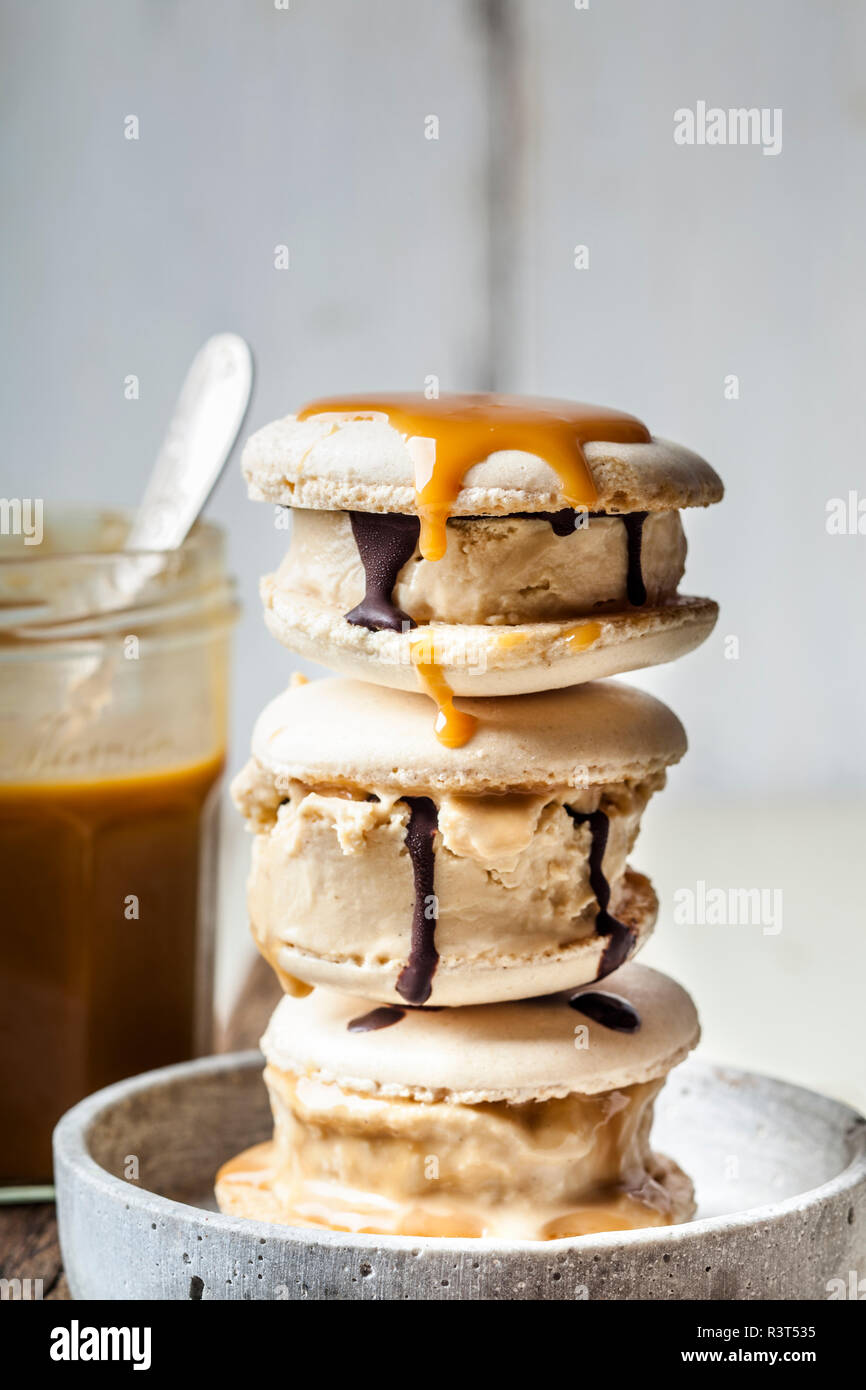 Stack of macarons filled with salted caramel icecream Stock Photo - Alamy