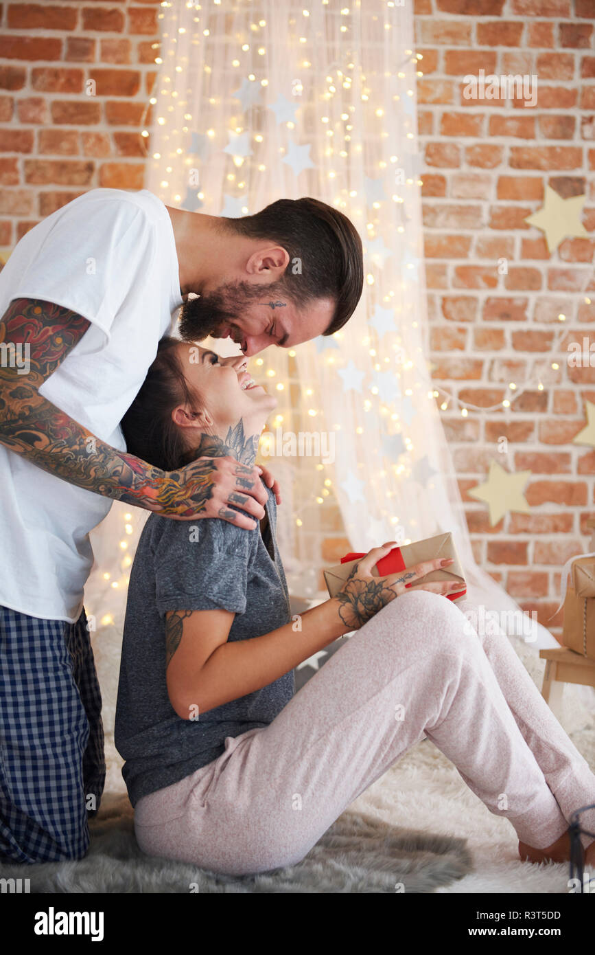 Happy young couple at home at Christmas time Stock Photo