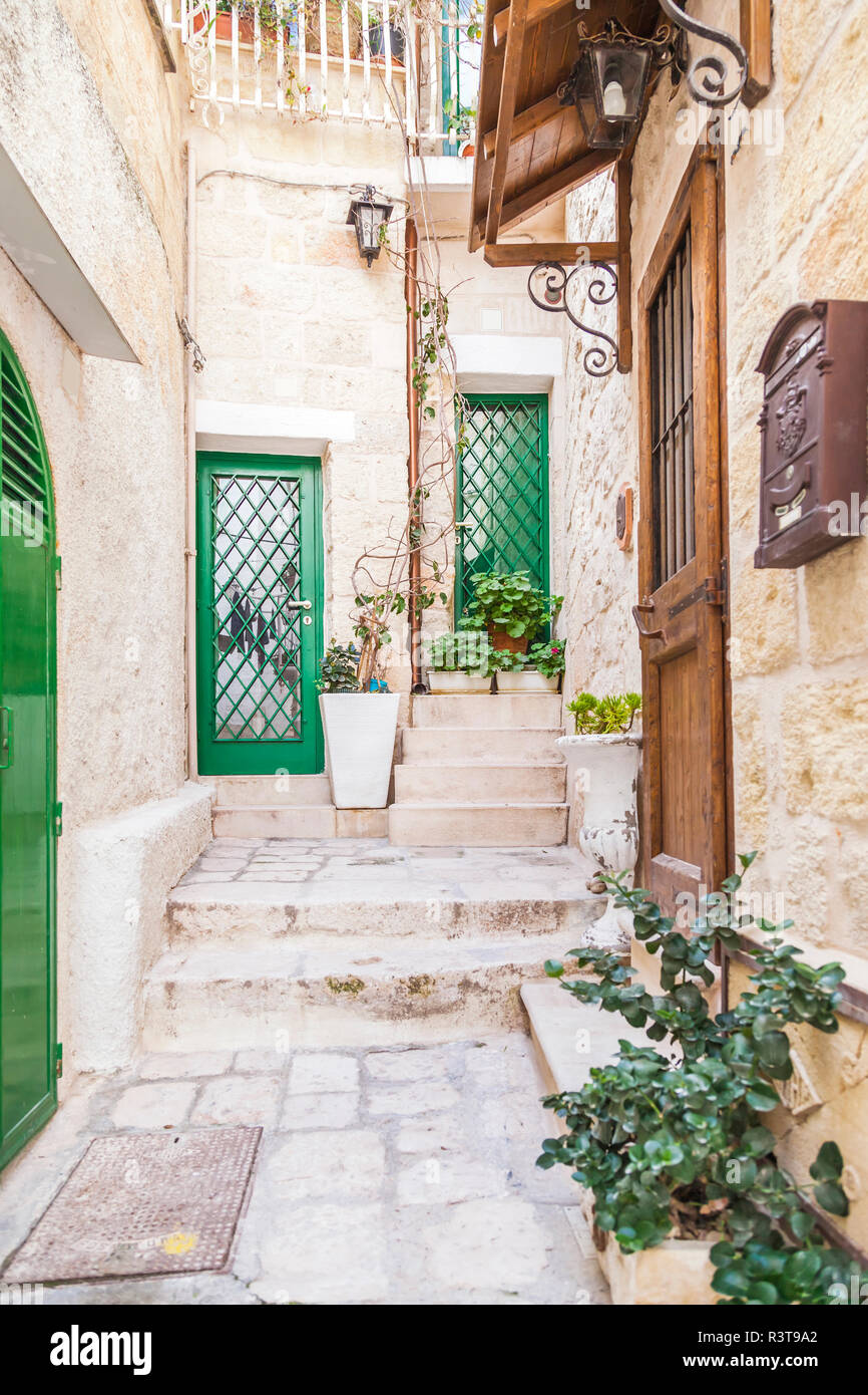 Italy, Puglia, Polognano a Mare, house entrances at historic old town Stock Photo