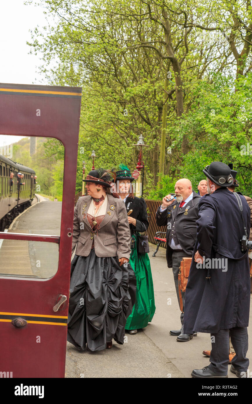 England, West Yorkshire. Keighley and Worth Valley Railway, steam trains, 5-miles up Worth Valley to Haworth and Oxenhope. Steampunk trainspotters. Stock Photo