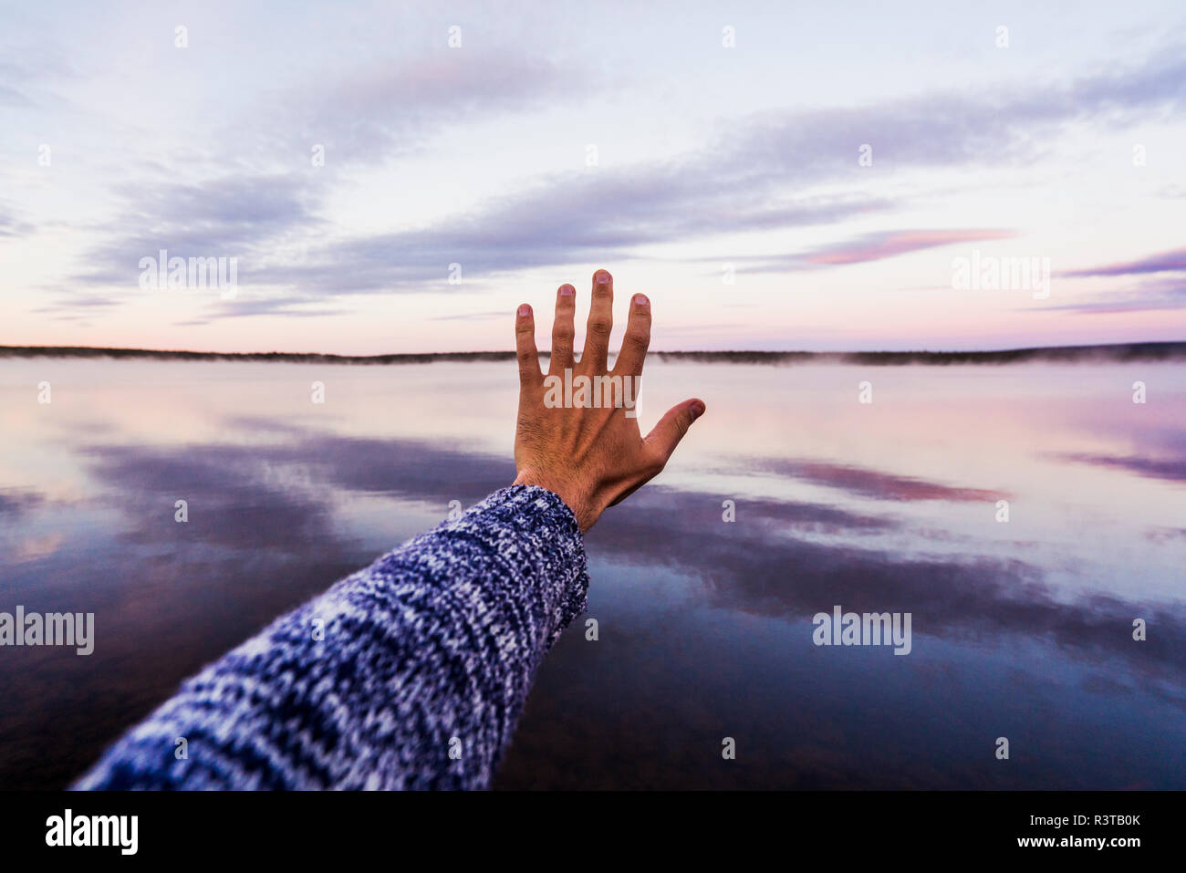 Hand reaching to sky hi-res stock photography and images - Alamy