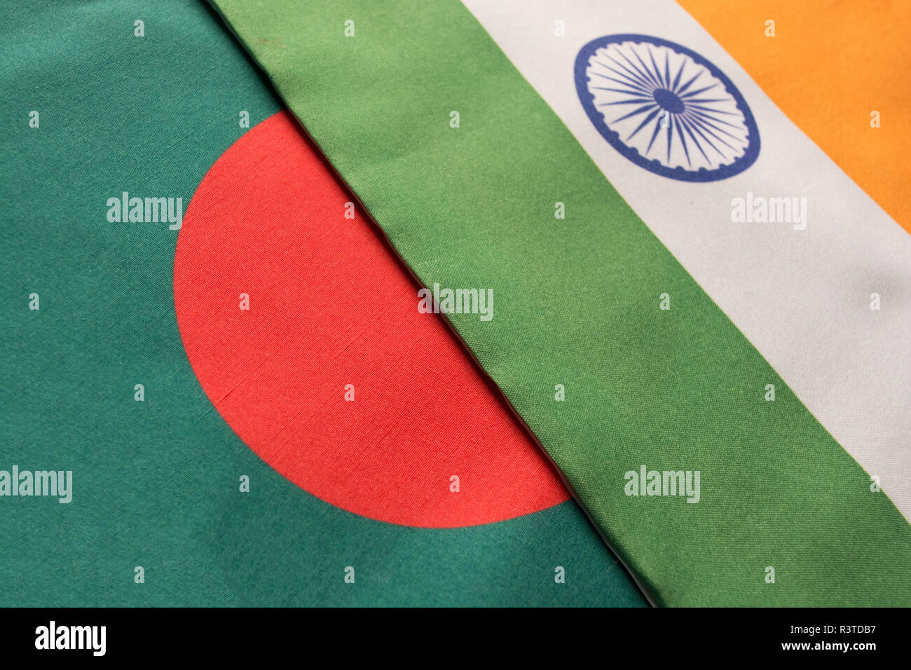 Bangladesh and Indian flags placed on table Stock Photo