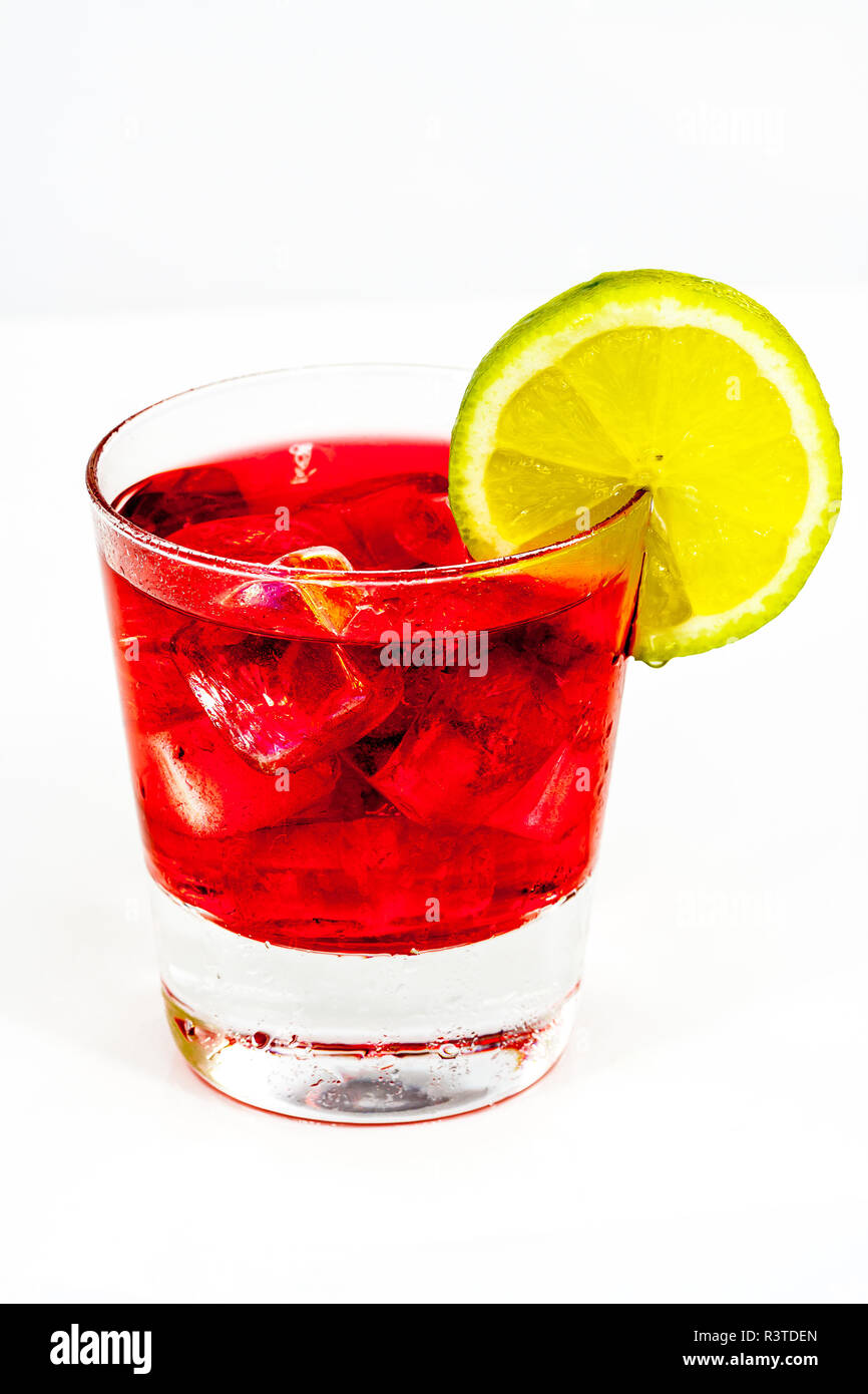 red cocktail with lemon and ice Stock Photo