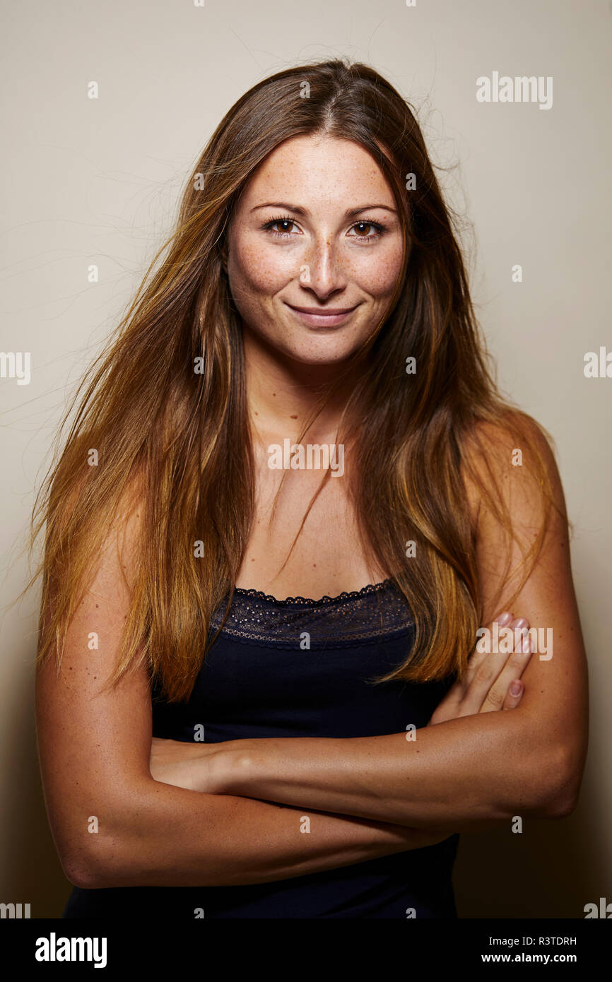 Young woman arms crossed eyes hi-res stock photography and images - Alamy