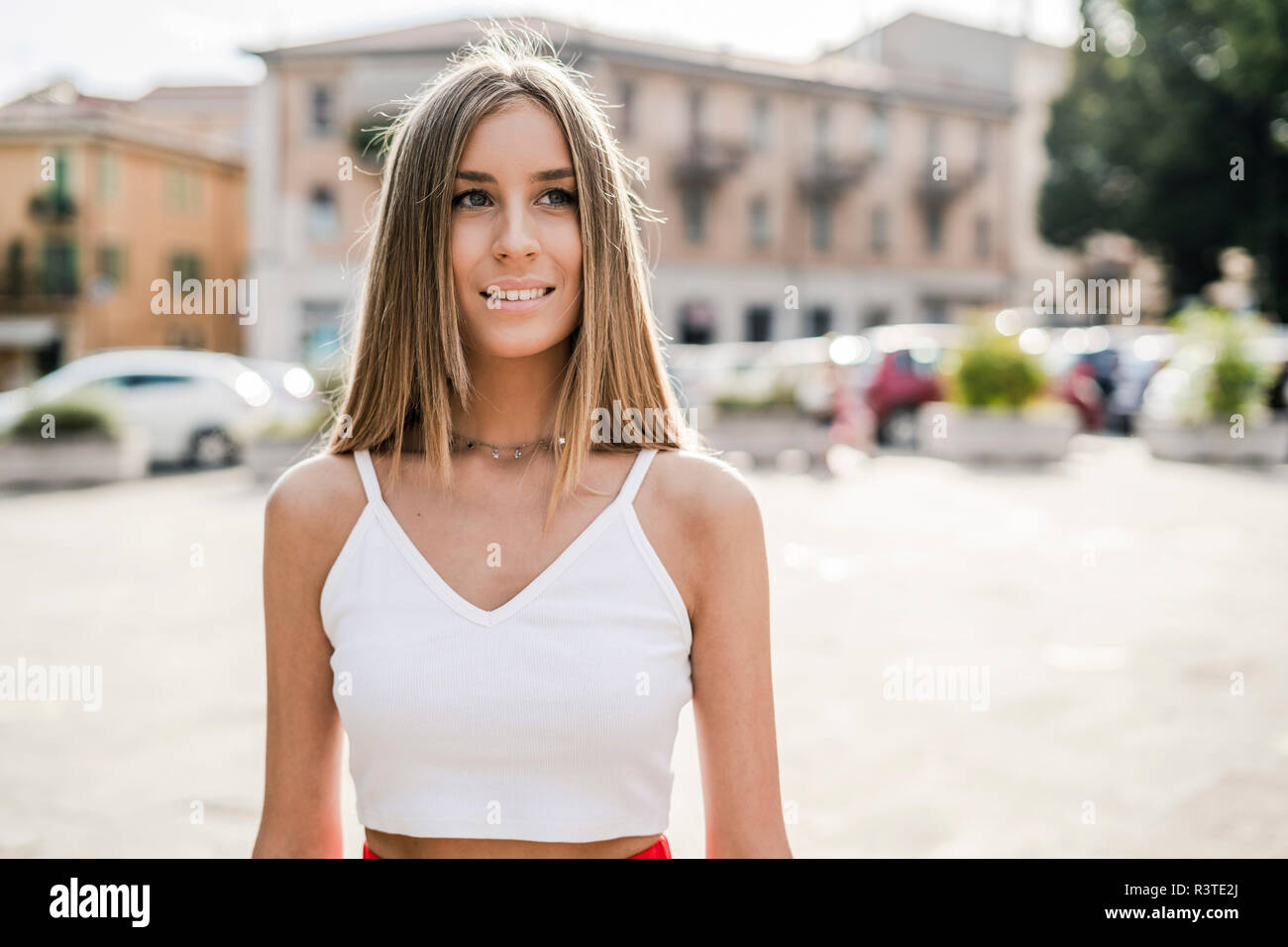 Portrait of smiling teenage girl in the city Stock Photo - Alamy