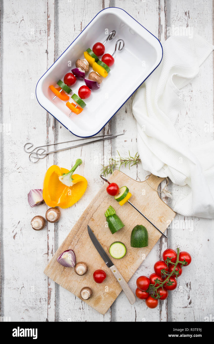 Vegetarian grill spits, orange and yellow paprika, tomato, red onion, zucchini and champignons Stock Photo