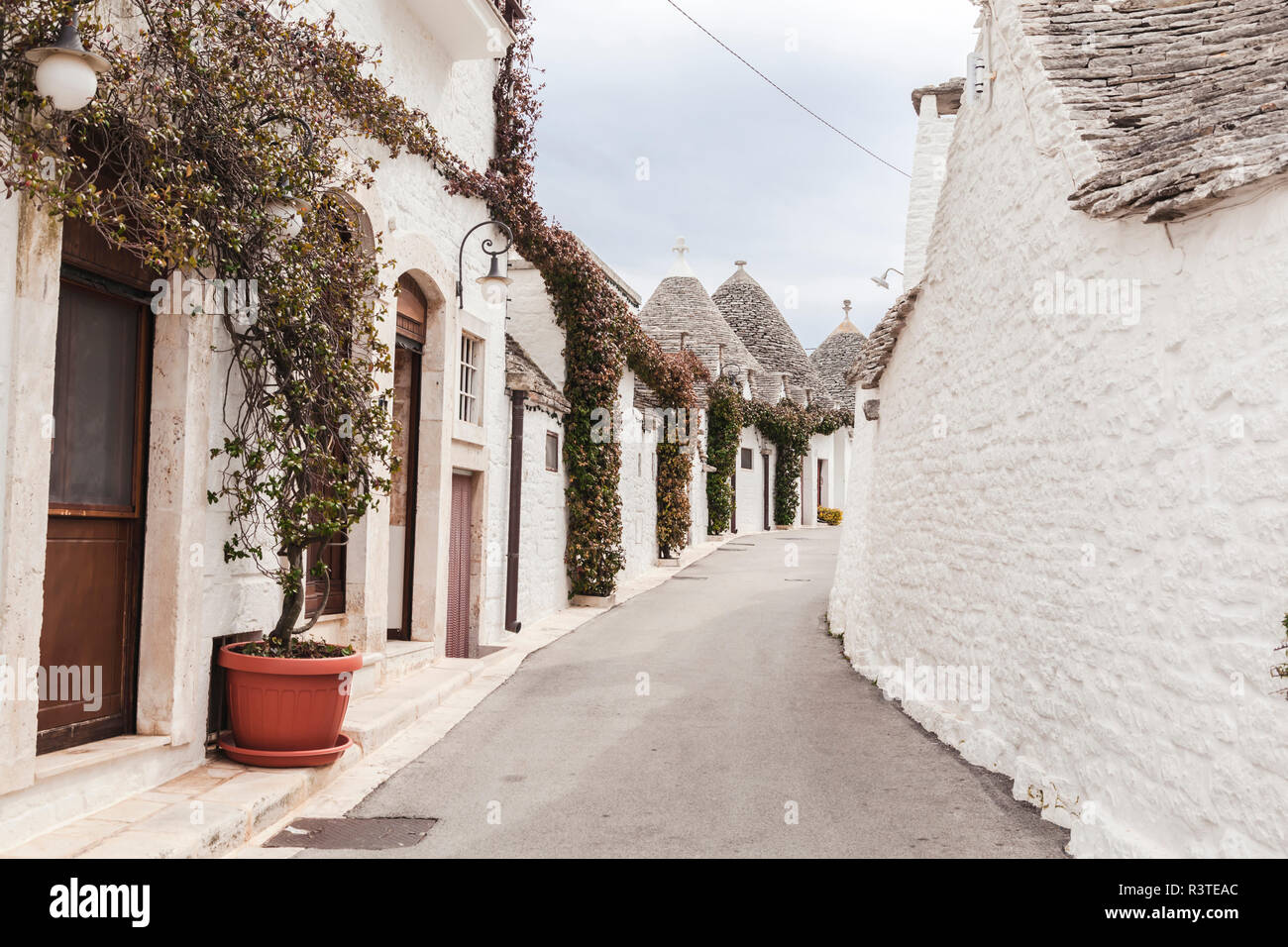 Italy, Apulia, Alberobello, view to alley with typically Trulli Stock Photo