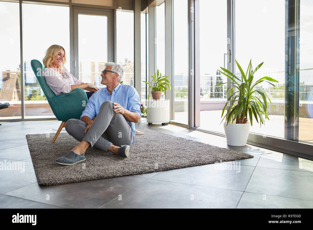 Smiling mature couple relaxing at home Stock Photo