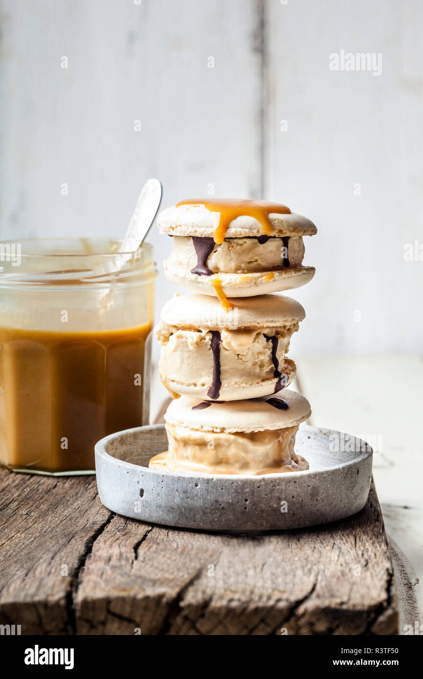 Stack of macarons filled with salted caramel icecream Stock Photo