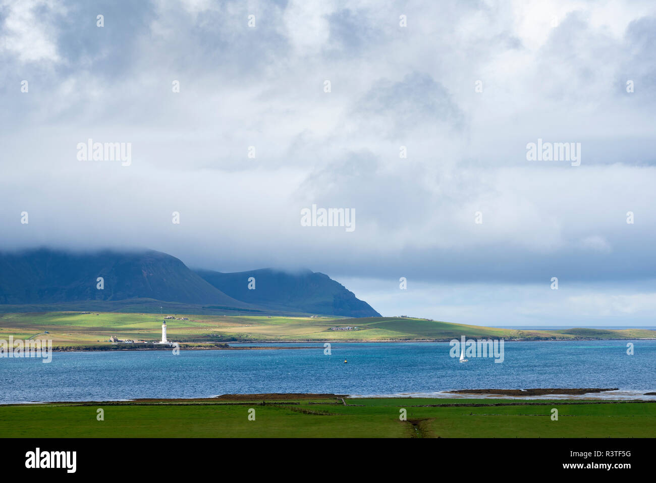 Great Britain, Scotland, Orkney, Mainland, View over Hoy Sound to lighthouse of Graemsay Island Stock Photo