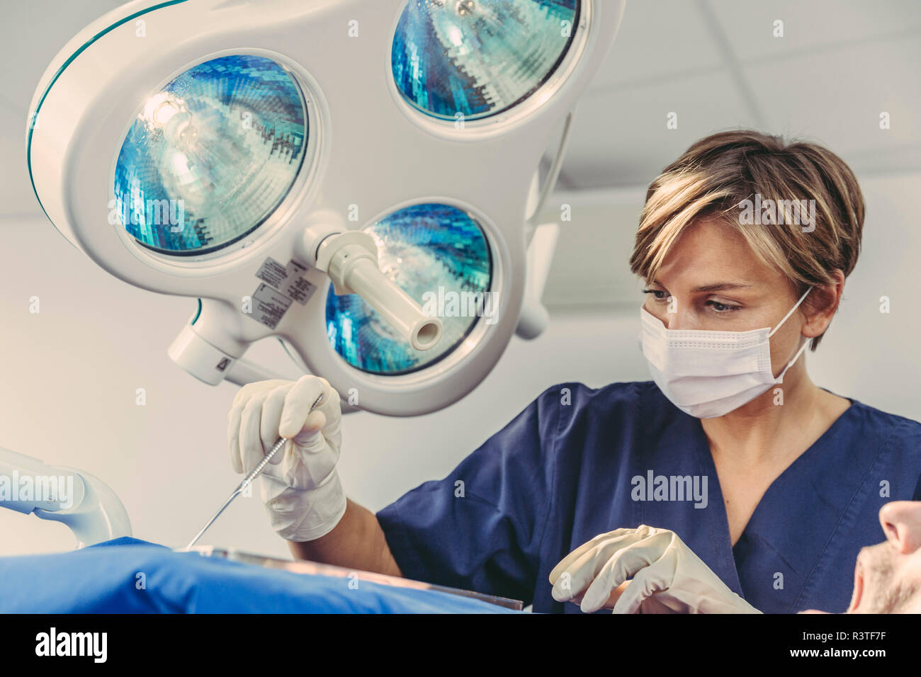 Dental surgeon during surgical procedure on a patient Stock Photo Alamy
