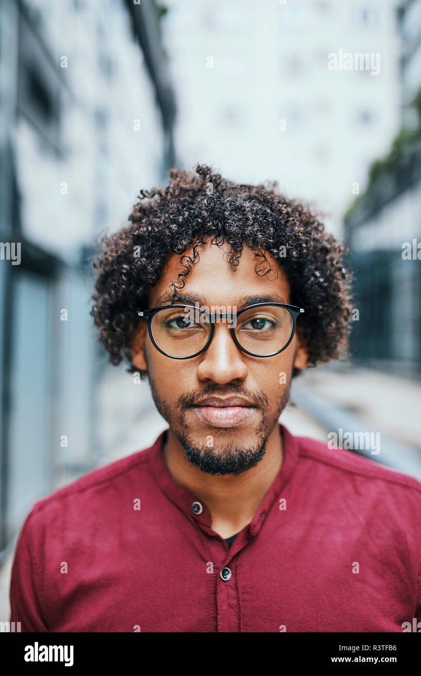 Portrait of a young man wearing glasses Stock Photo - Alamy