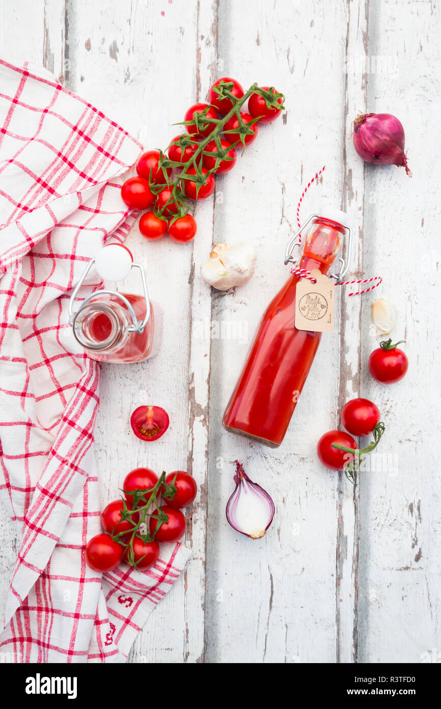 Homemade tomato ketchup and ingredients Stock Photo
