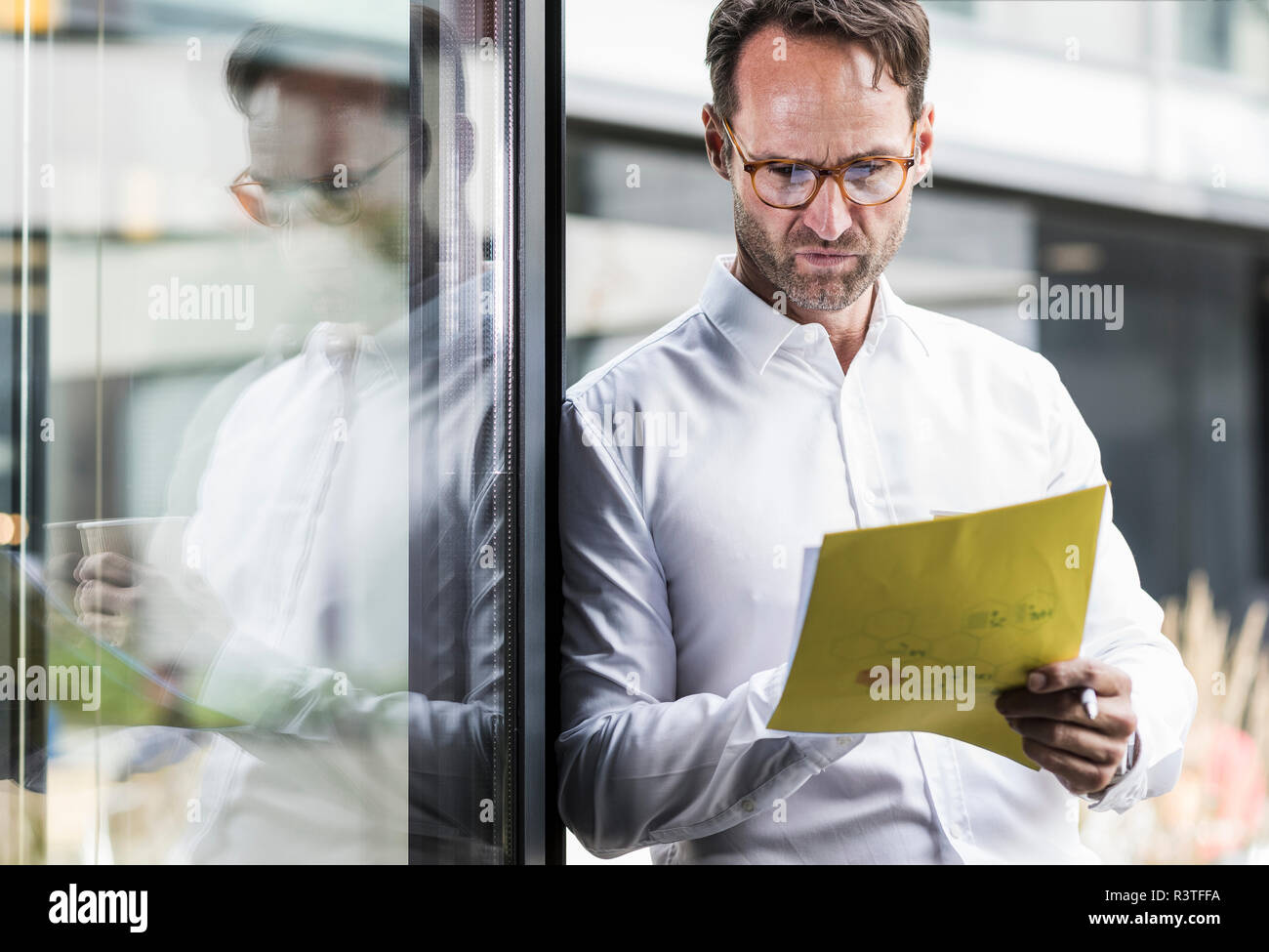 Businessman checking papers Stock Photo