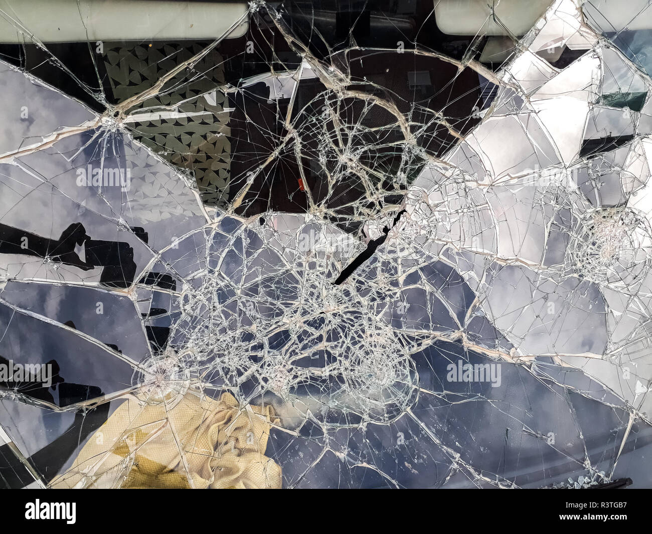 Car windshield shattered with stones by vandals Stock Photo Alamy