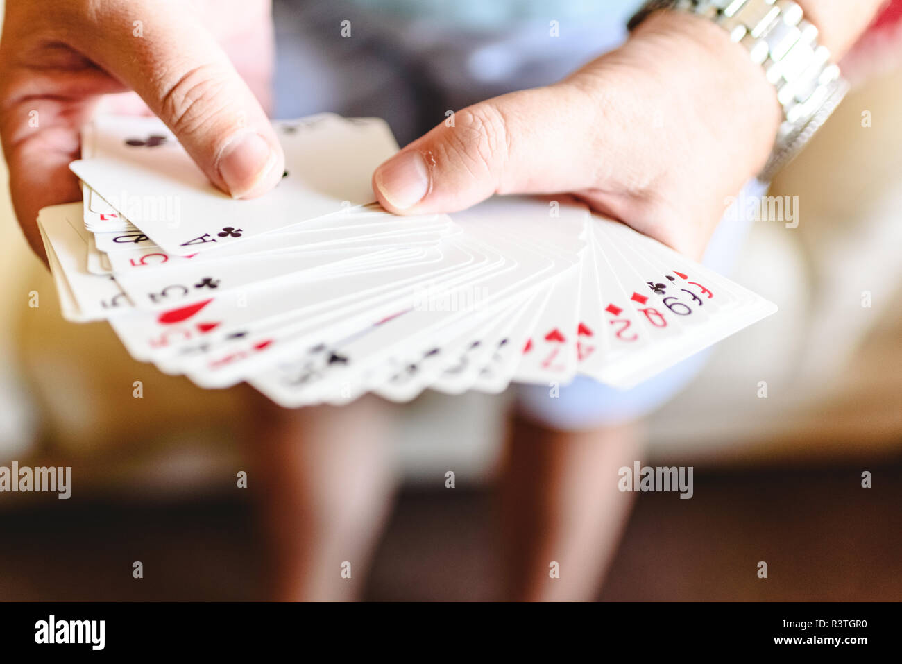Magician hands doing magic trick with playing cards Stock Photo Alamy