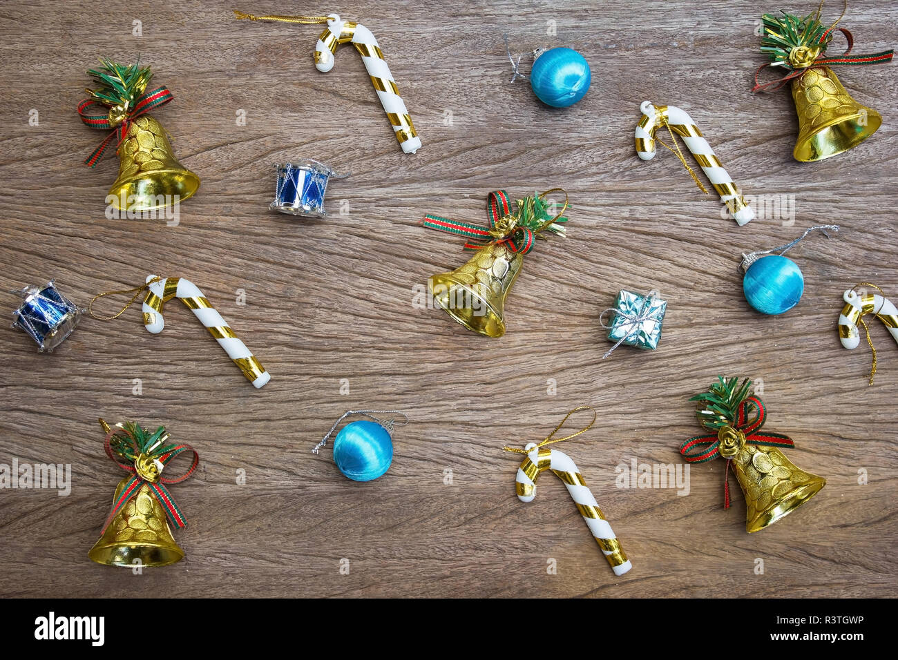 Christmas Background Golden Bell And Decoration On Wooden Table