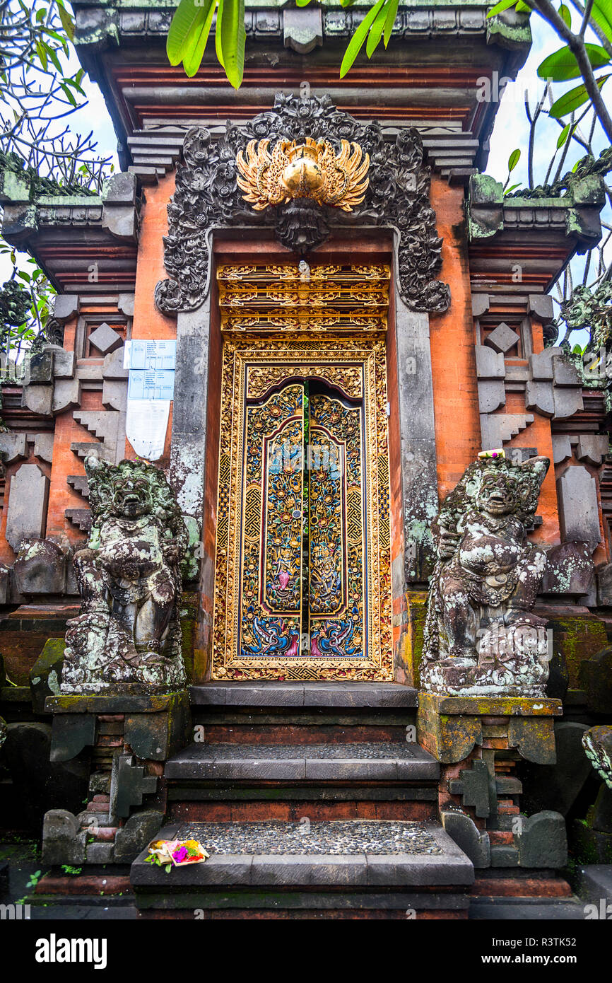 Ubud Gold Hindu Temple door in the middle of town. Stock Photo