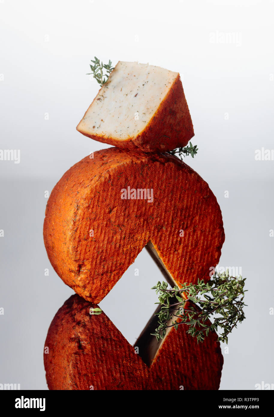 Red Pecorino sheep milk cheese with thyme and pepper. Traditional sheep