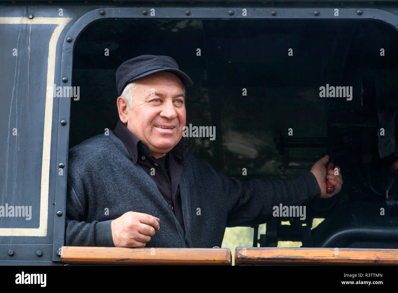 Romania. Moldovita, old steam train. Engineer. Stock Photo