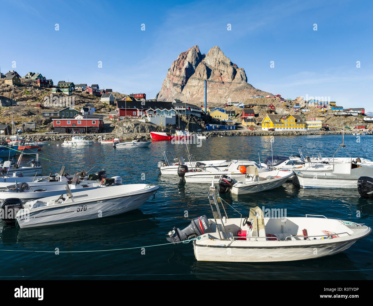 Harbor with typical fishing boats. Small town of Uummannaq in northwest Greenland, Denmark Stock Photo
