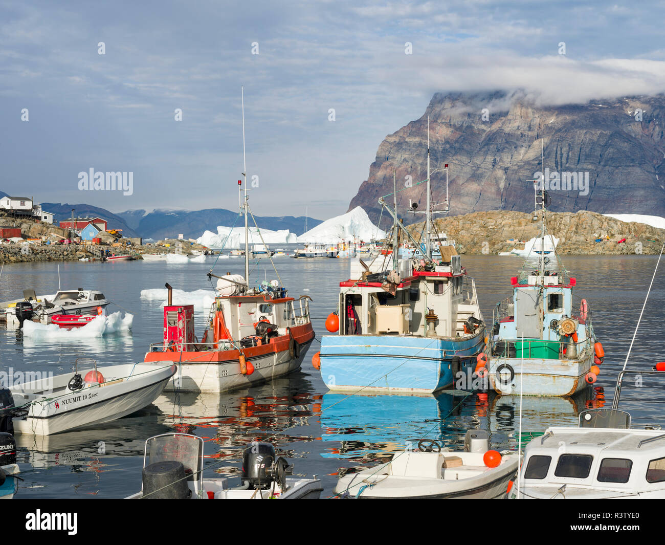 Harbor with typical fishing boats. Small town of Uummannaq in northwest Greenland, Denmark Stock Photo