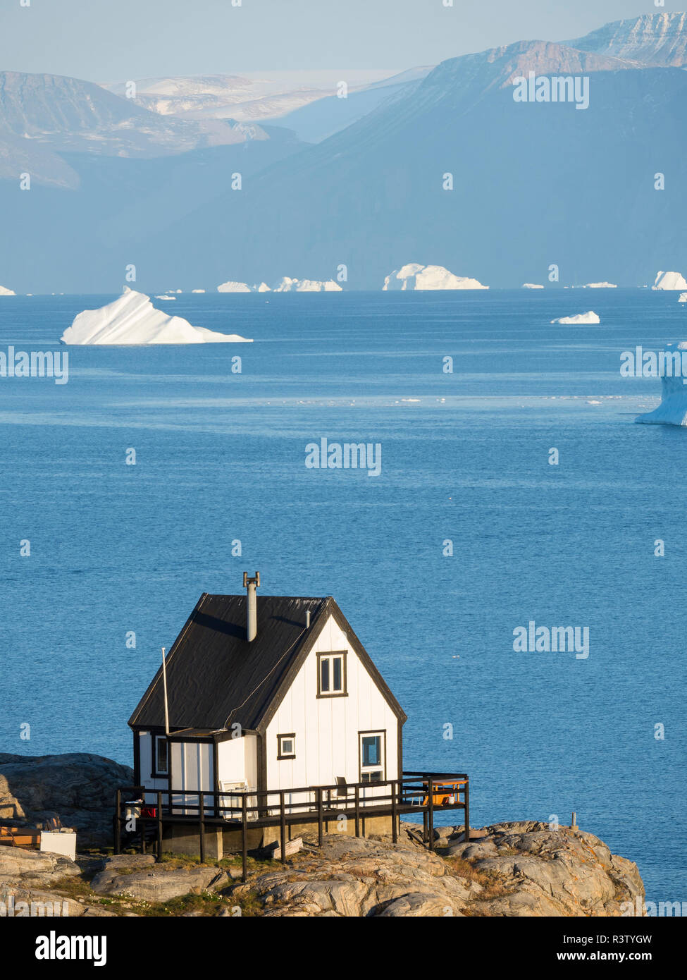 Small town of Uummannaq and glaciated Nuussuaq Peninsula in the background. Greenland, Denmark (Editorial Use Only) Stock Photo