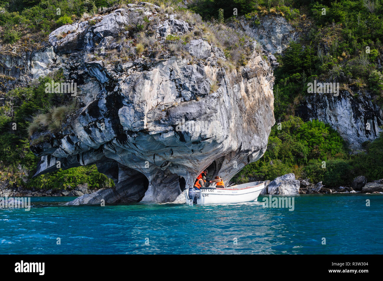 Chile, Aysen, Puerto Rio Tranquilo, Marble Chapel Natural Sanctuary. Tour boat exploring the limestone formations. Stock Photo
