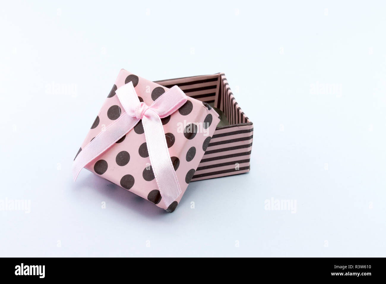 Pink gift box is opened isolated on white background Stock Photo - Alamy