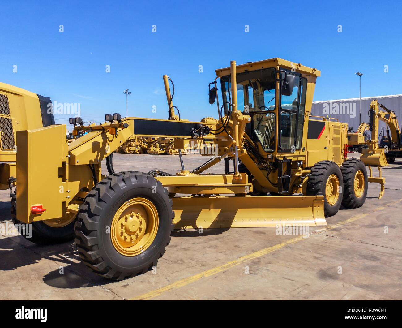 Brand new yellow road grader Stock Photo