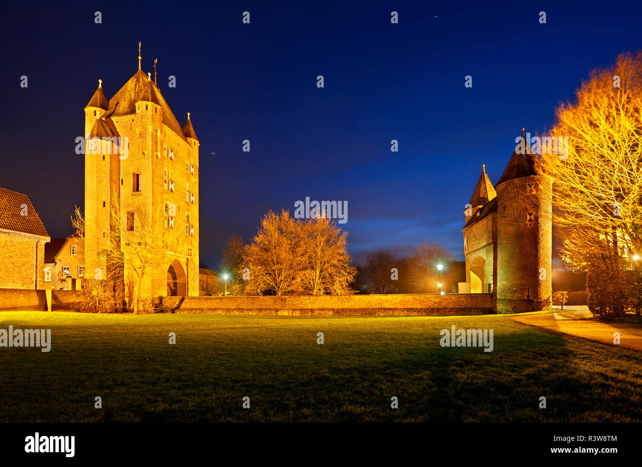 The old Kleve Gate (Klever Tor) in Xanten, Germany. Panoramic night shot with blue sky. Stock Photo
