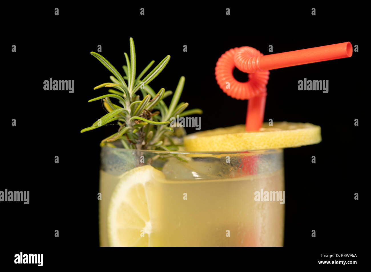 Long Island cocktail with vodka, tequila, rum, cin and lime juice with isolated black background