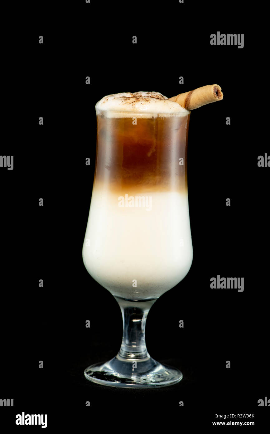 Alcoholic coffee cocktail with coffee liqueur, fresh cream and milk with isolated black