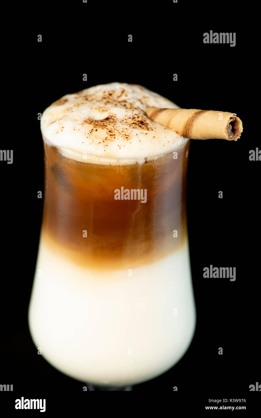 Alcoholic coffee cocktail with coffee liqueur, fresh cream and milk