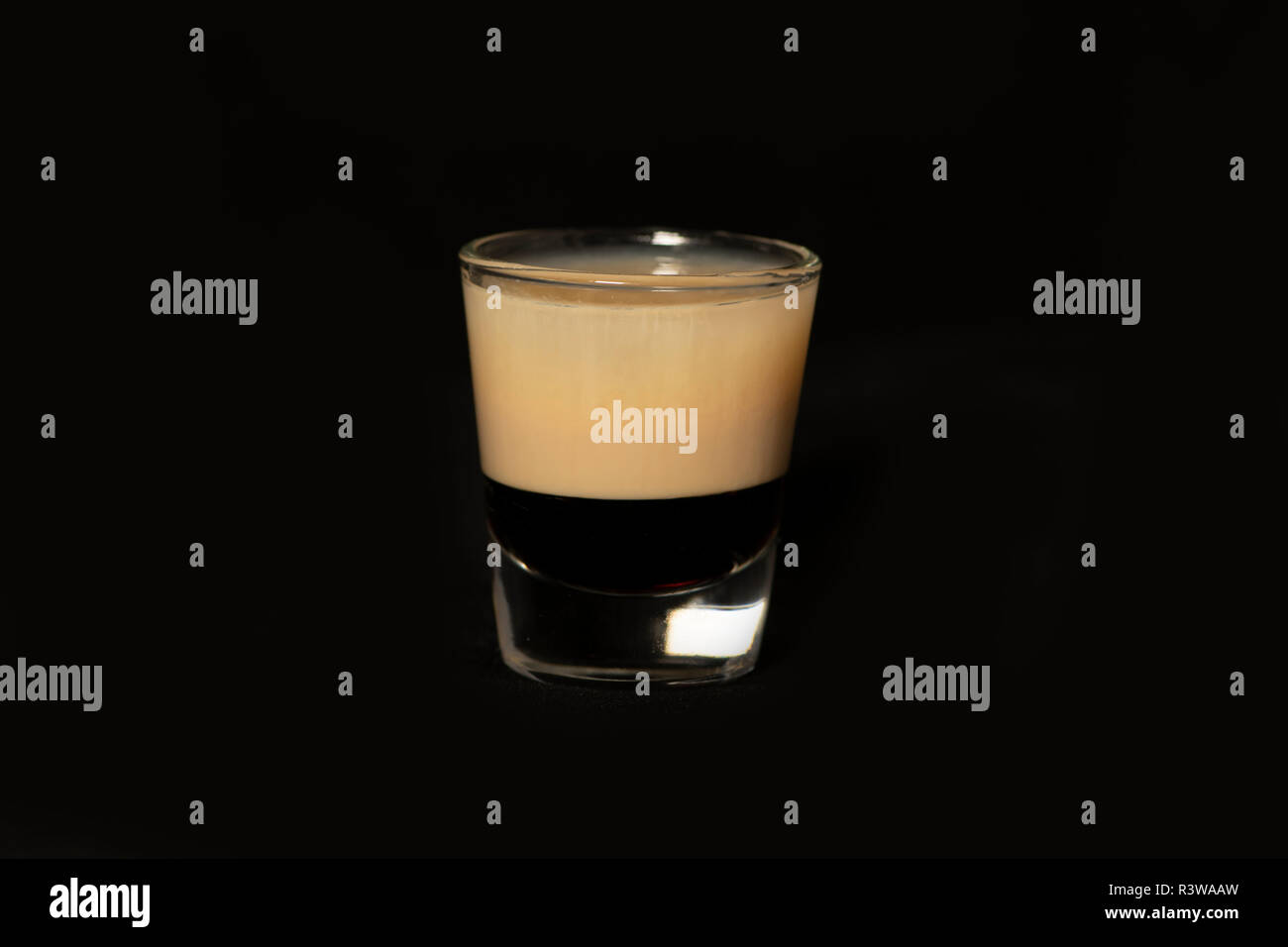 B52 cocktail with kahlua, baileys and cointreau with isolated black background Stock Photo Alamy