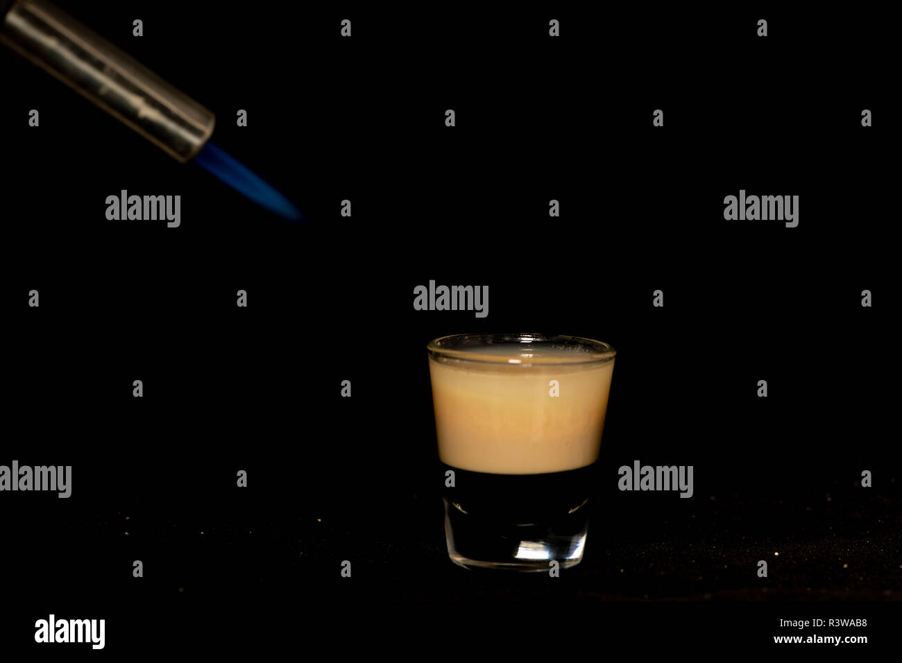 B52 cocktail with kahlua, baileys and cointreau with isolated black background Stock Photo