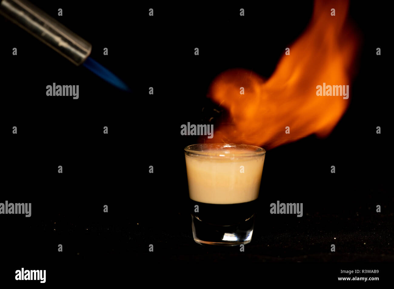 B52 cocktail with kahlua, baileys and cointreau with isolated black background Stock Photo