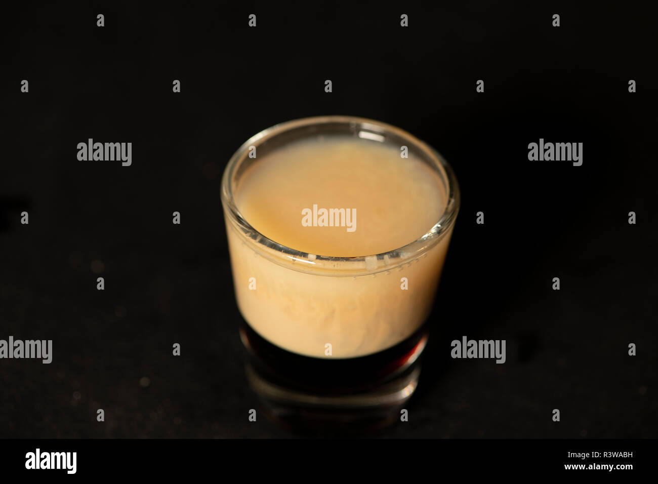 B52 cocktail with kahlua, baileys and cointreau with isolated black