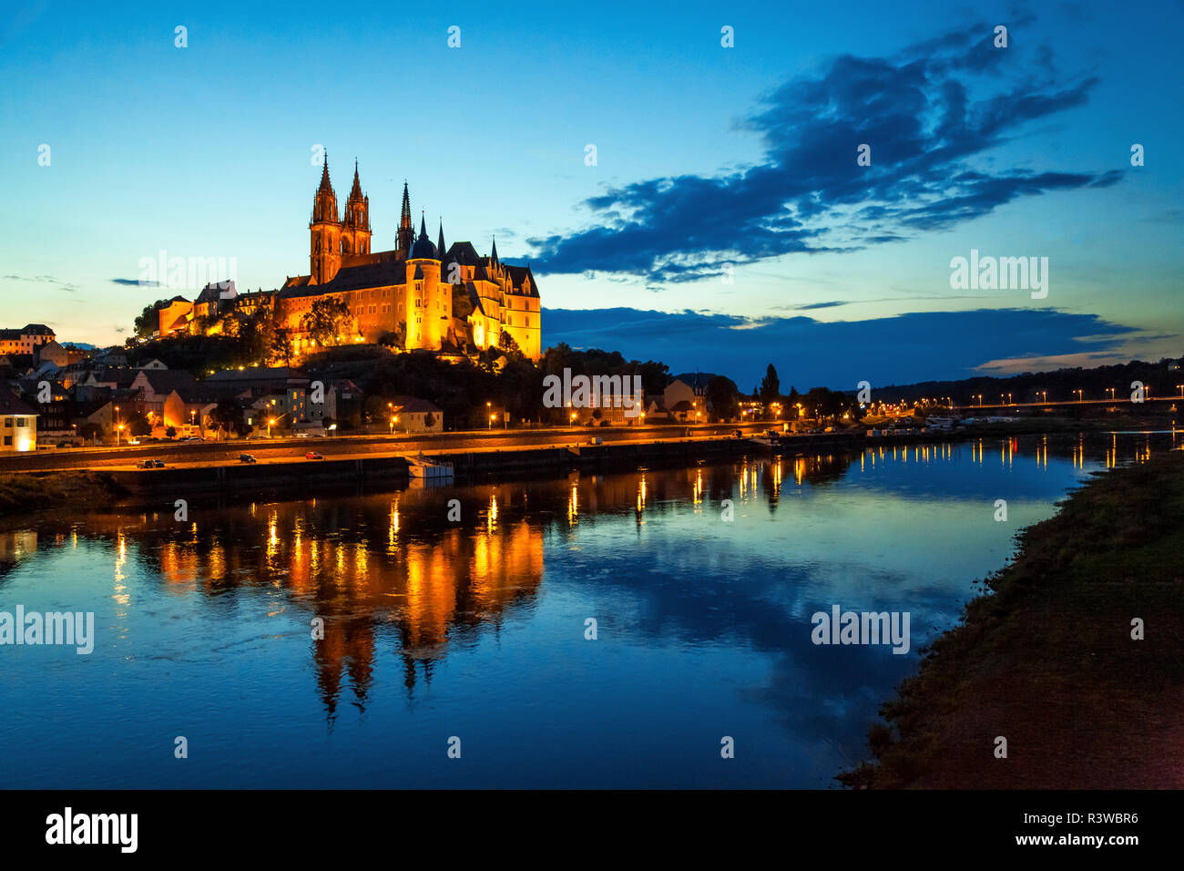 Germany, Meissen, view to lighted Albrechtsburg castle with Elbe River in the foreground Stock Photo
