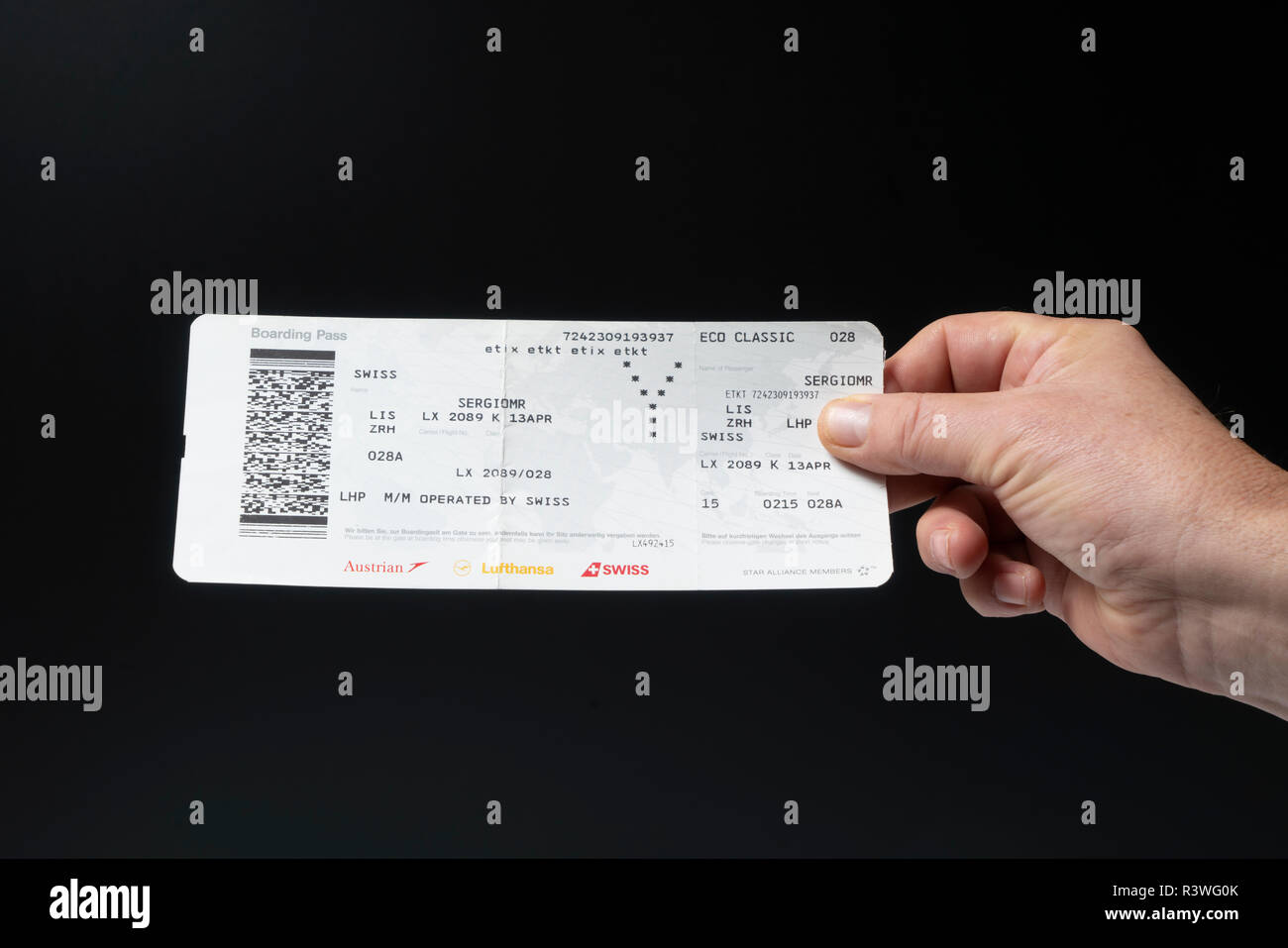 A Swiss Airlines Boarding pass on the hand Stock Photo