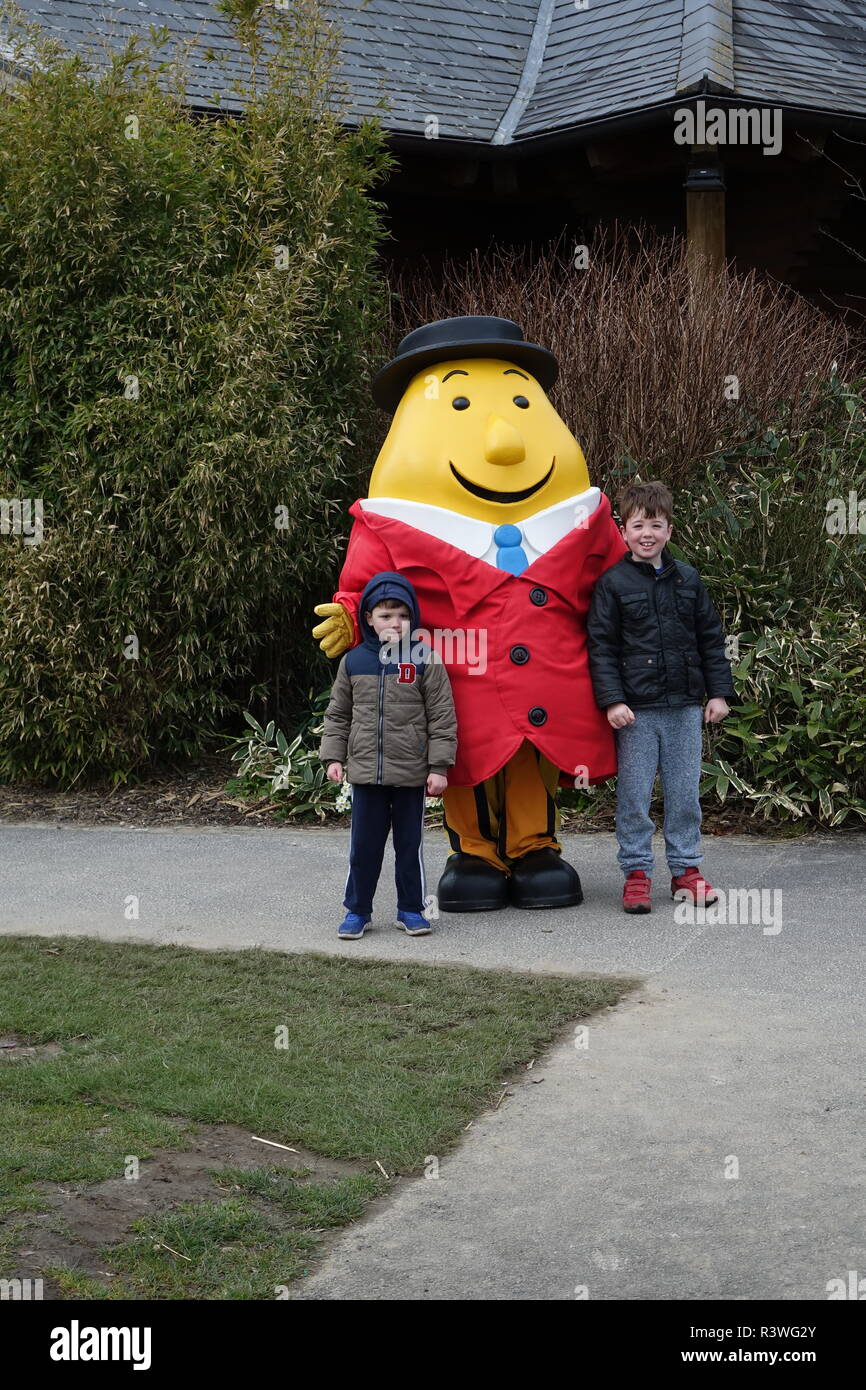 Two excited young boys posing with the cartoon character with bog smiles in Tayto Park, Kilbrew, Ashbourne, Co. Meath, A84 EA02, Ireland Stock Photo
