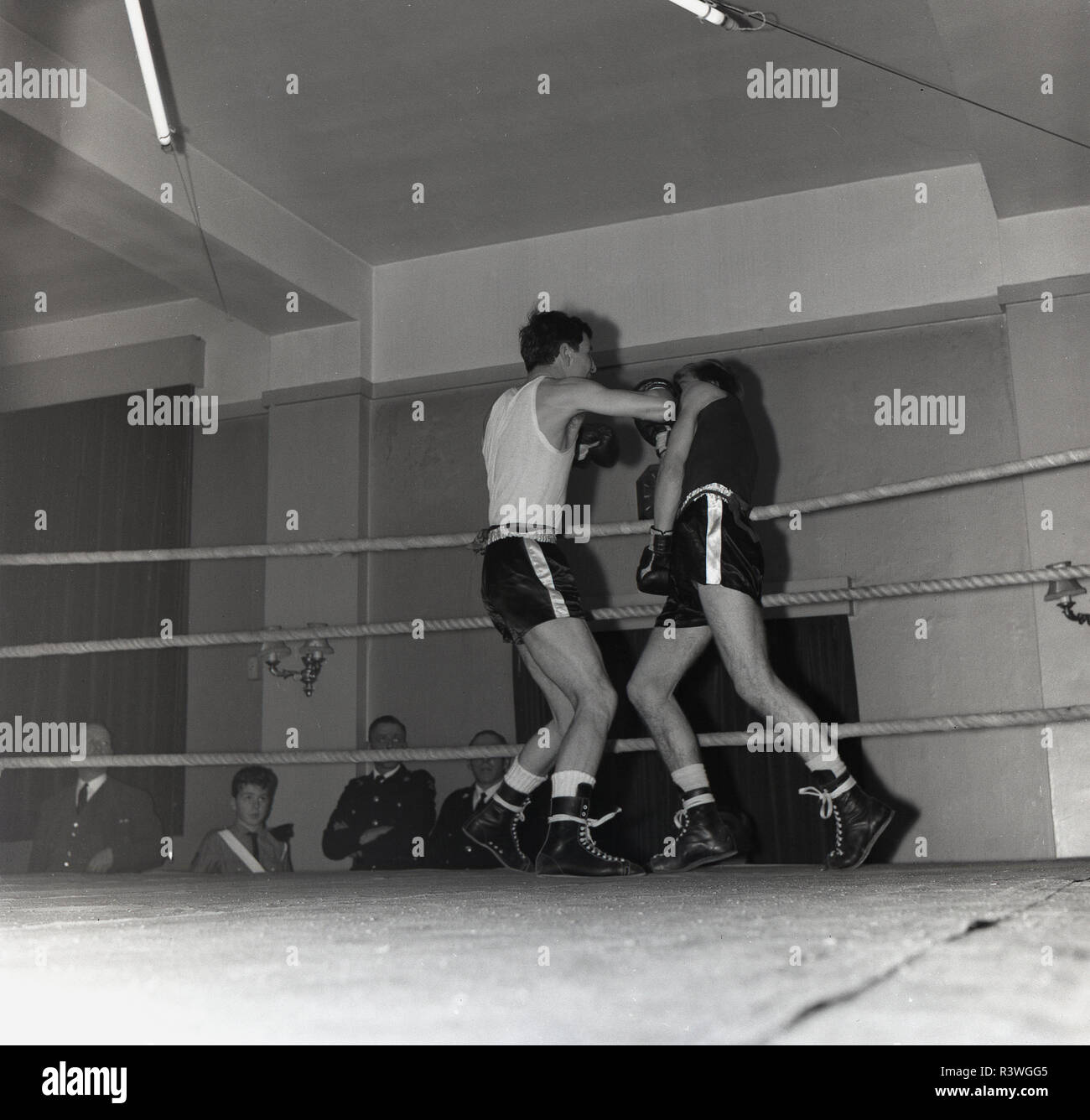 1965, historical, two young male boxers in a boxing ring f