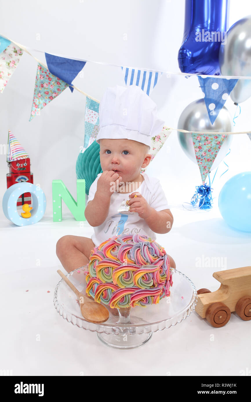 1 year old toddler, cake smash birthday cake Stock Photo