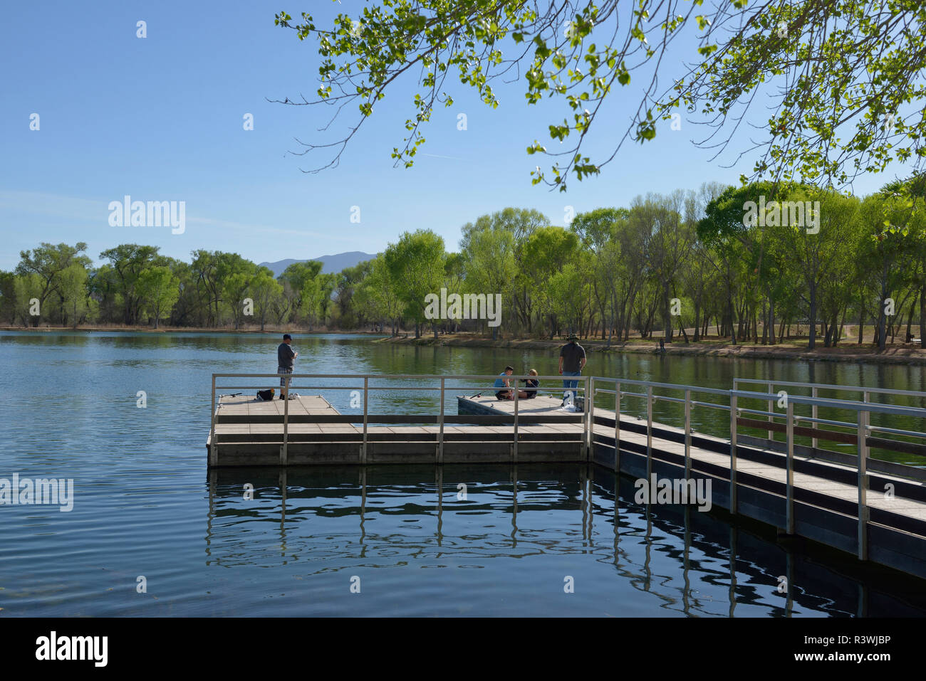 USA, Arizona, Dead Horse Ranch State Park, people fishing from a dock
