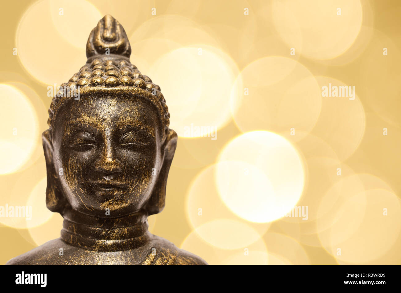 buddha with yellow bokeh lights Stock Photo