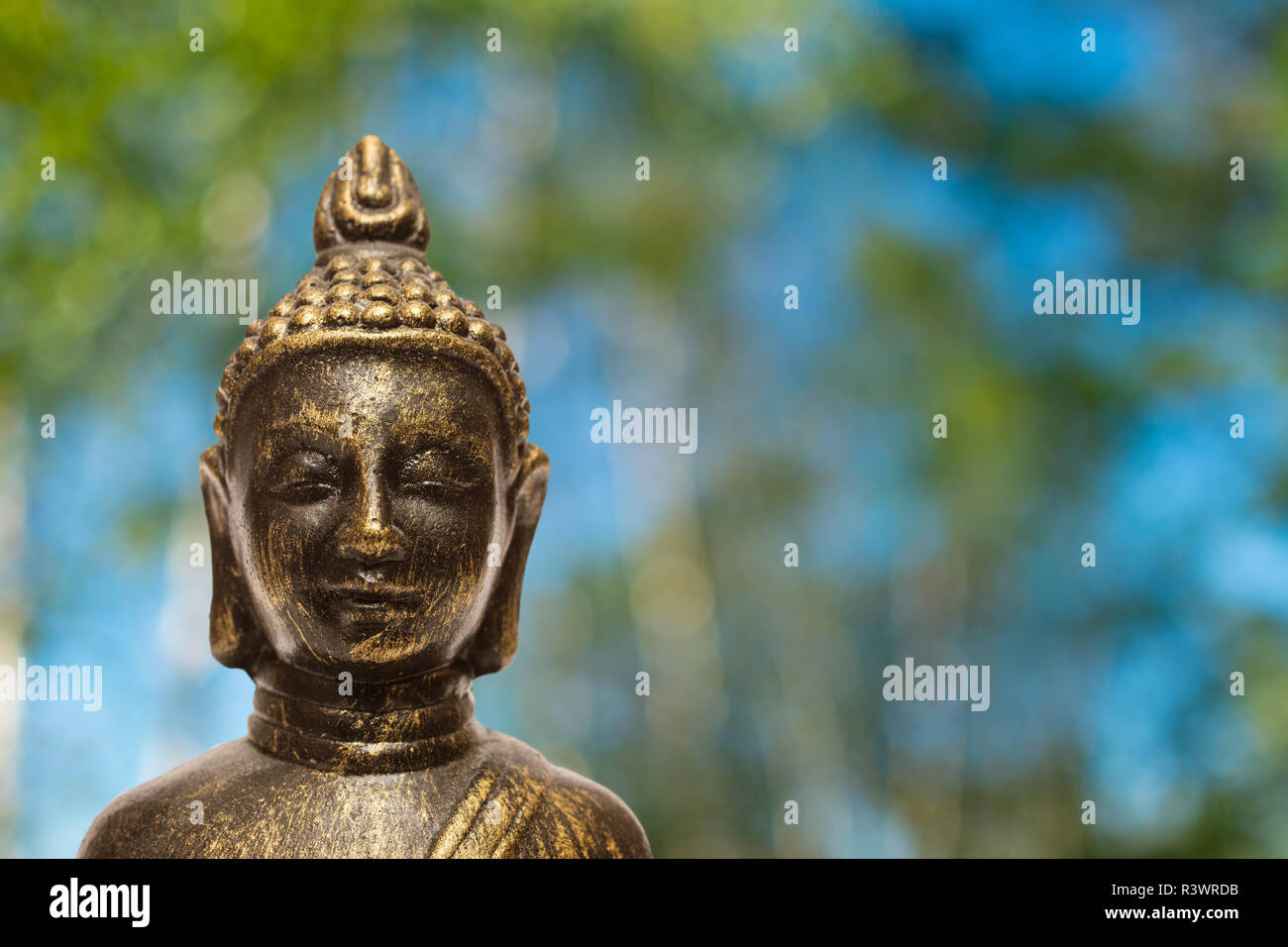 buddha with blurred trees Stock Photo