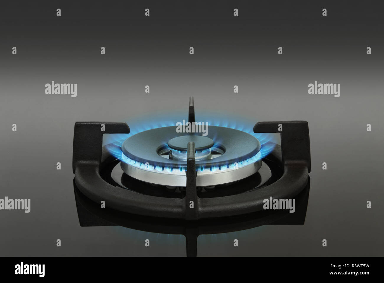 Single gas burner cooker hob with blue flames Stock Photo Alamy