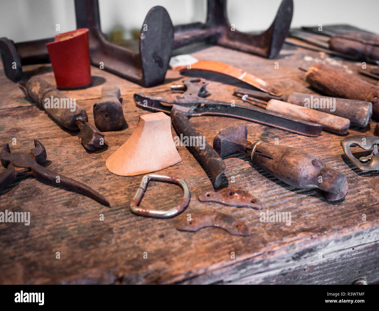 Detail of the wooden counter of a shoemaker Stock Photo - Alamy