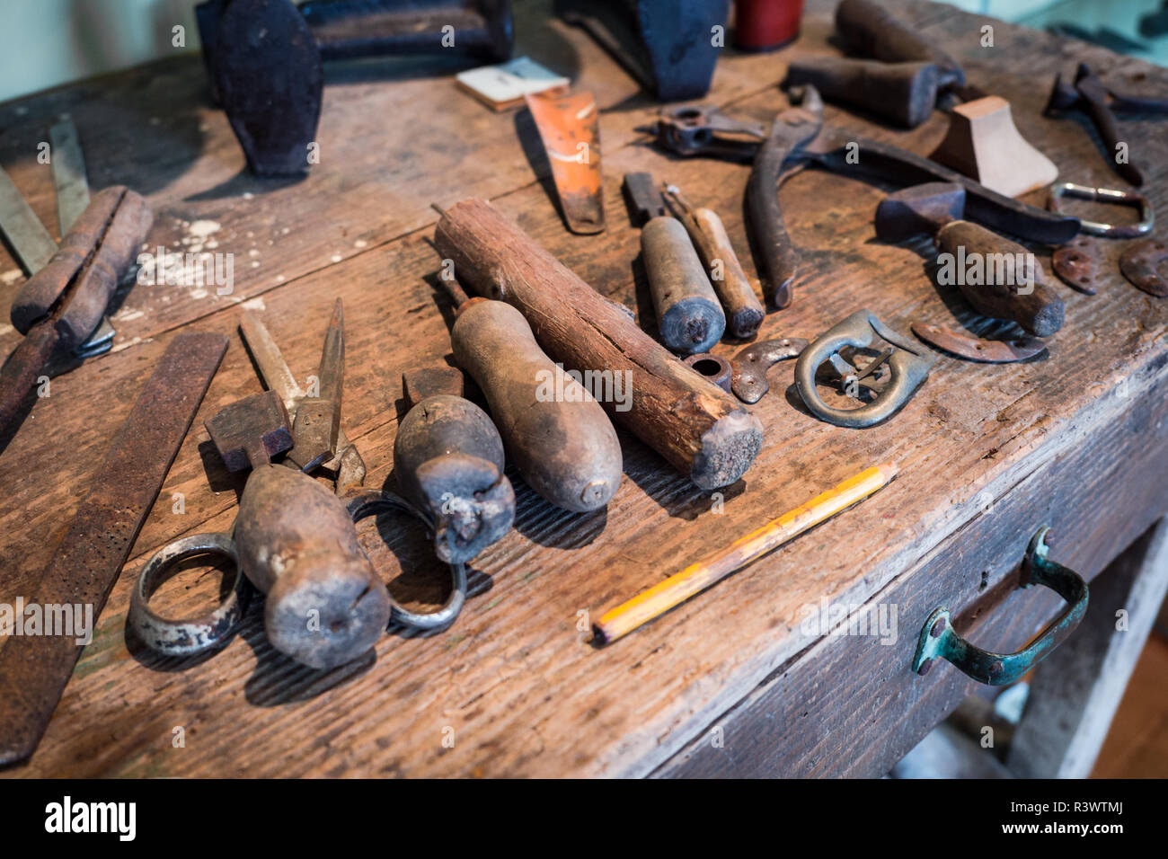 Detail of the wooden counter of a shoemaker. Stock Photo
