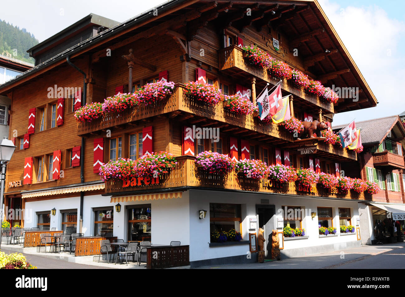 Swiss Alps: The Hotel Bären, a flower decorated wooden chalet in Adelboden in the Bernese Oberland Stock Photo